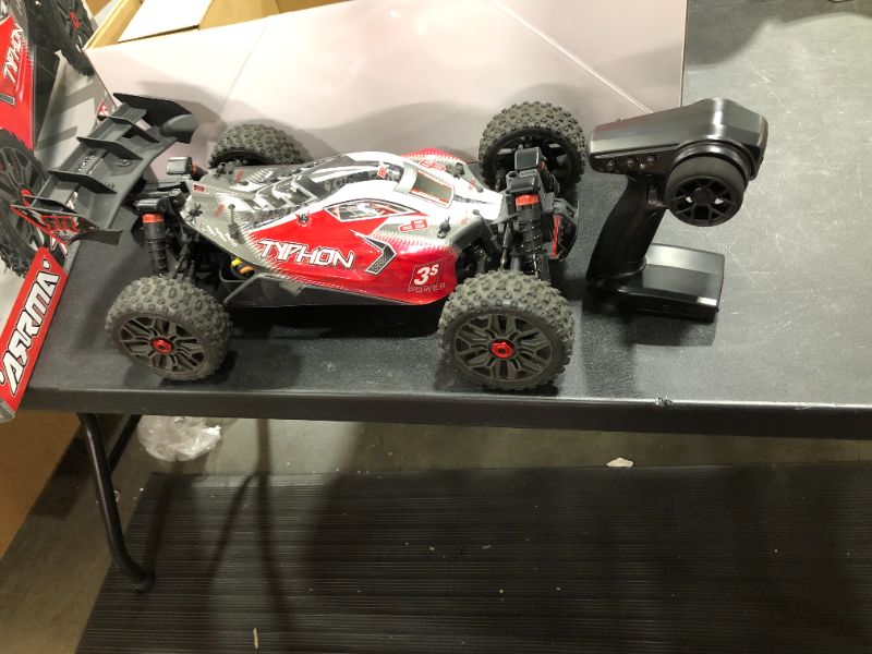 Photo 2 of ARRMA 18 Typhon 4X4 V3 3S BLX Brushless Buggy RC Truck RTR Transmitter and Receiver Included Batteries and Charger Required Red ARA4306V3