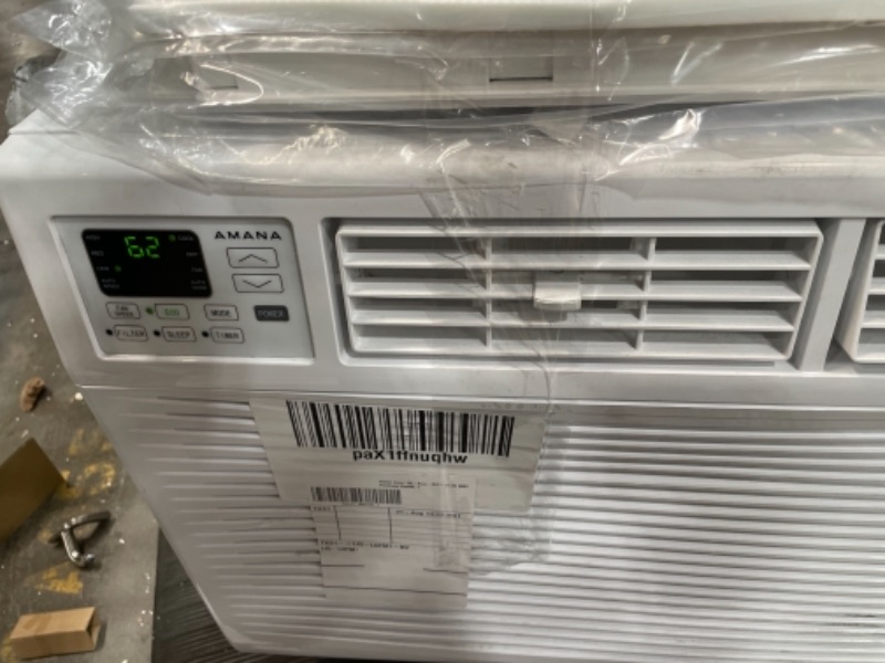 Photo 1 of AMANA 15000 BTU 115V WindowMounted Air Conditioner with Remote Control White BLOWS HOT AIR AND MAKES A LOUD NOISE