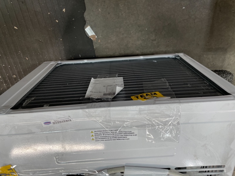 Photo 1 of AMANA 15000 BTU 115V WindowMounted Air Conditioner with Remote Control White BLOWS HOT AIR AND MAKES A LOUD NOISE