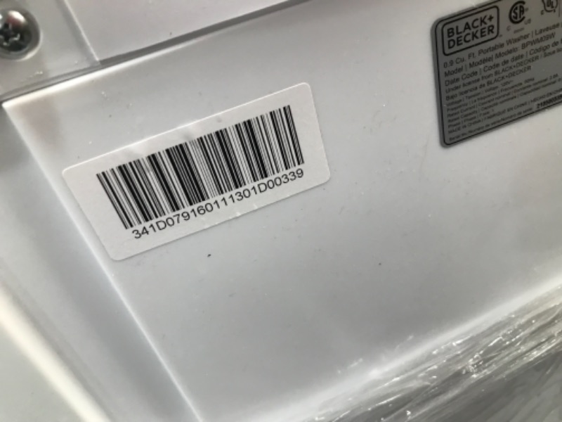 Photo 1 of BLACK  DECKER 09 cubic foot compact portable washer clothes washing machine White                              has a small crack in  the side plastic ring