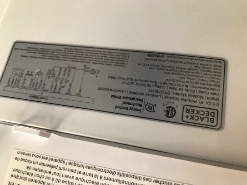 Photo 1 of BLACK  DECKER 09 cubic foot compact portable washer clothes washing machine White                              has a small crack in  the side plastic ring