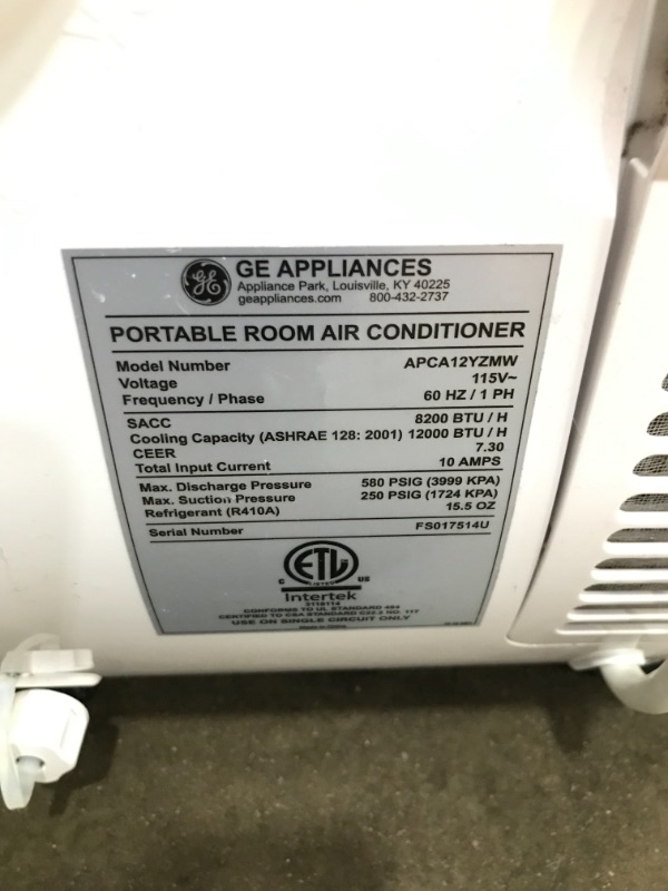 Photo 2 of GE Appliances 3in1 APCA12YZMW White GE Portable Air Conditioner with Dehumidifier for Medium Rooms up to 450 sq ft 12000 8200 BTU SACC 
USED COSMETIC DAMAGE TESTED PRODUCT PRODUCT TURNS ON  SETTINGS WORK