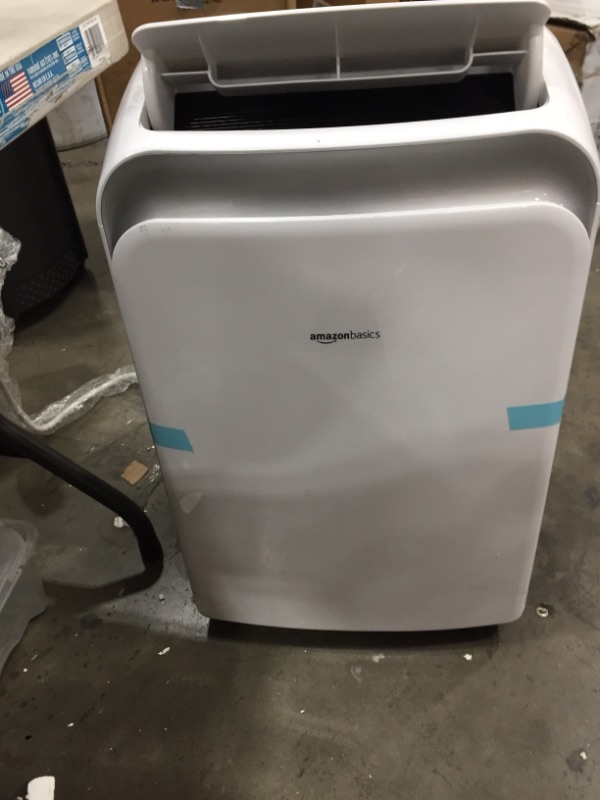 Photo 1 of Amazon Basics Portable Air Conditioner with Remote  Cools 550 Square Feet 12000 BTU ASHARE  8000 BTU SACC