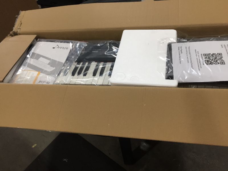 Photo 2 of Donner DEP10 beginner digital piano 88key fullsize semiemphasized keyboard portable electric piano with continuous pedal power supply