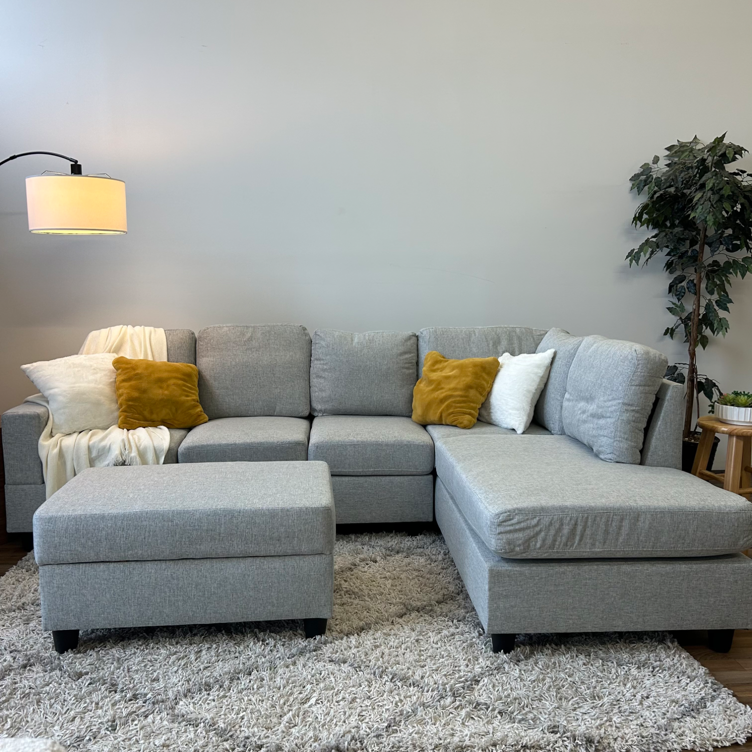  Reversible gray Sectional w/ storage ottoman Image #1 | Ivy Store