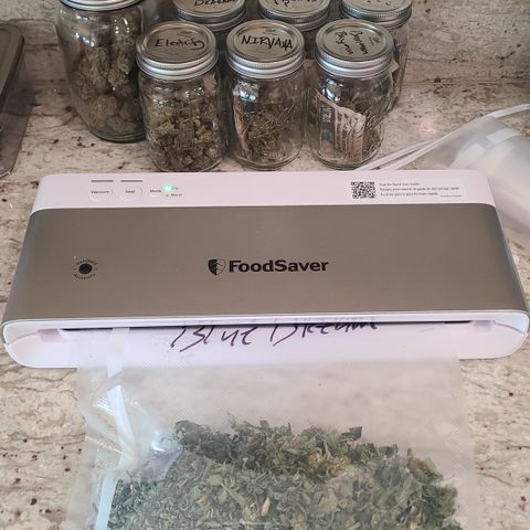 Blue Dream growlog photo: Bit of Blue Dream rosin. Bagging leftovers for edibles 