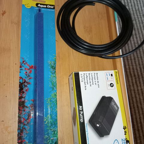 C - 🦍glue #4 growlog photo: Due to sediment settling to the bottom of our water tank, we decided to add an air stone with an air pump to our tank. We plan to use this combo at high speeds to continuously mix the water to prevent sediment settling. As this pump isn't for fish, we decided against a check valve for the tubing. This set up will need rinsing at the same intervals as the water pump in the tank 