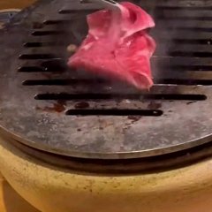 Omi beef is quickly grilled and eaten with egg yolk.