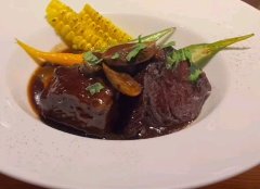 Omi beef cooked in large chunks with aromatic vegetables and red wine