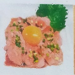 Yukhoe with heart meat. Served with raw egg yolk.