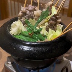 A different kind of motsu nabe (motsu hot pot) with motsu on skewers