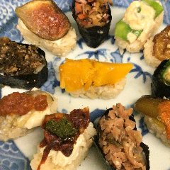 Vegan sushi course with 15 items served in Japanese antiques and lacquerware.