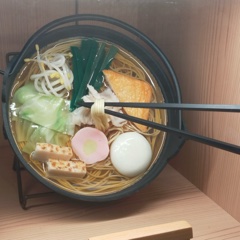 Healthy noodle dishes cooked in an iron pot