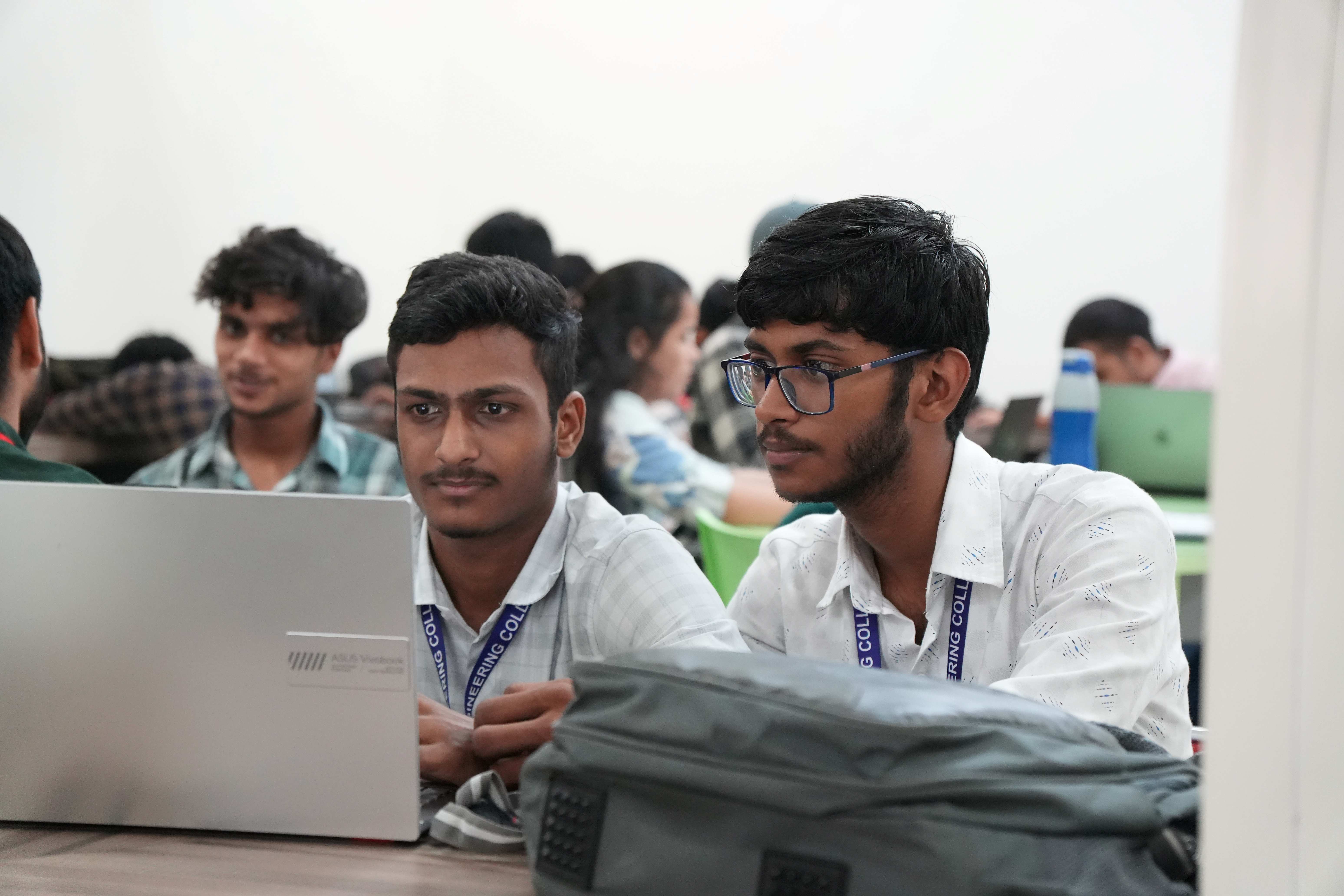 Engineering students reading in library