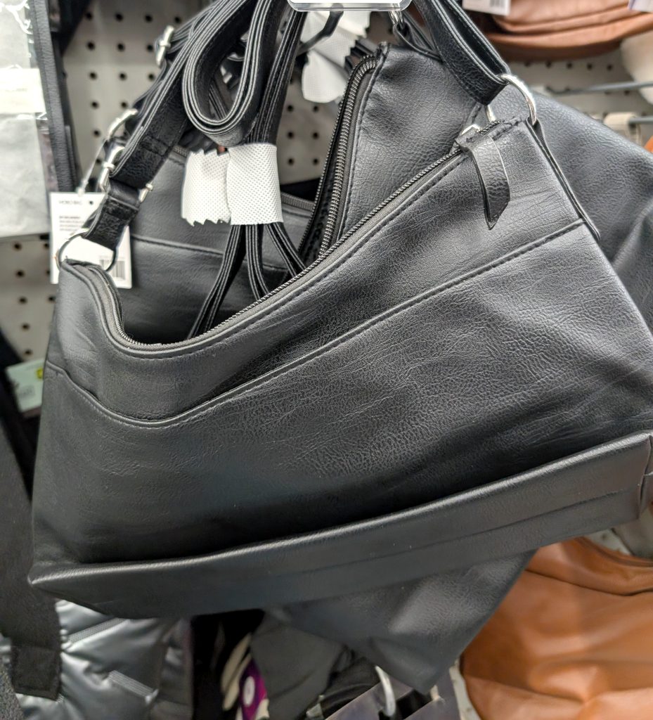 Black faux-leather hobo bag from Dollarama for $5, ideal for everyday use and styling.