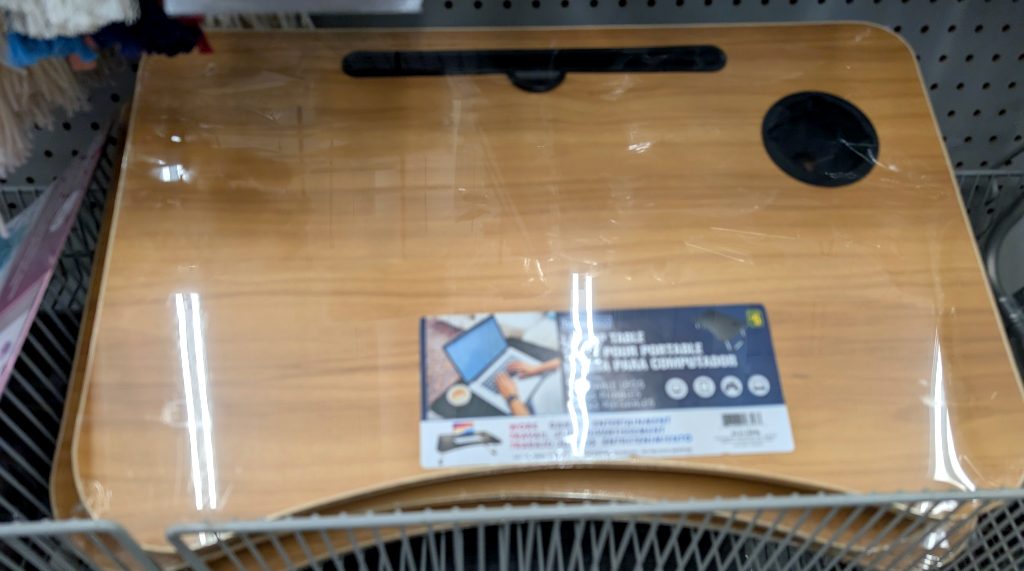 Light wood grain portable laptop table with integrated cup holder and tablet slot from Dollarama for comfortable work.