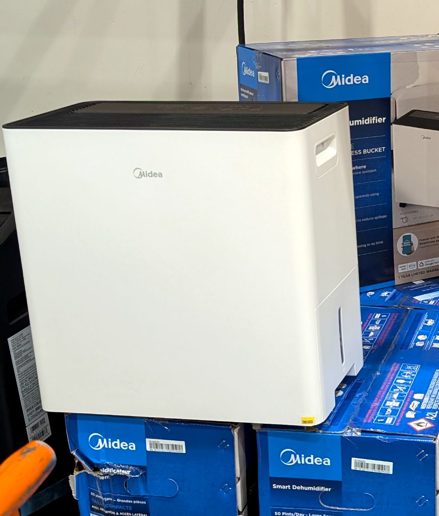 White Midea 50-pint dehumidifier with pump from Costco, ideal for large spaces and smart home integration.