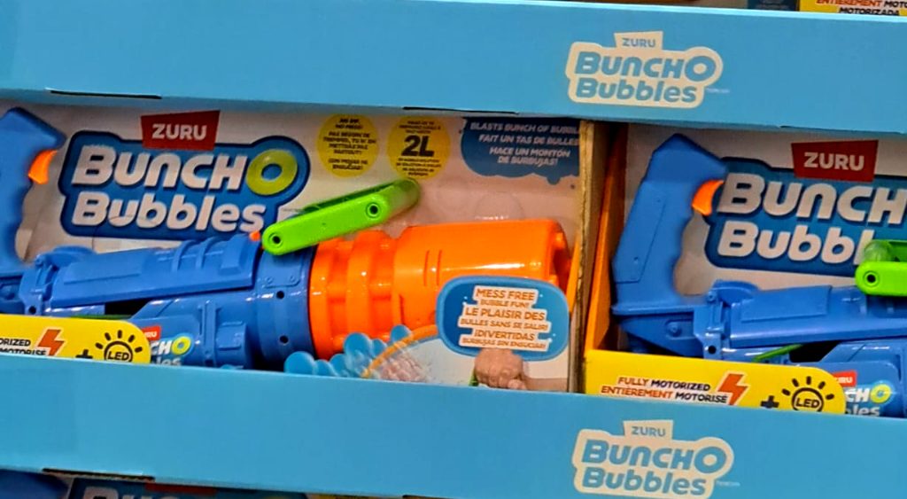 Blue and orange Zuru Bunch O Bubbles fully motorized spinning barrel bubble blaster from Costco, $19.99.