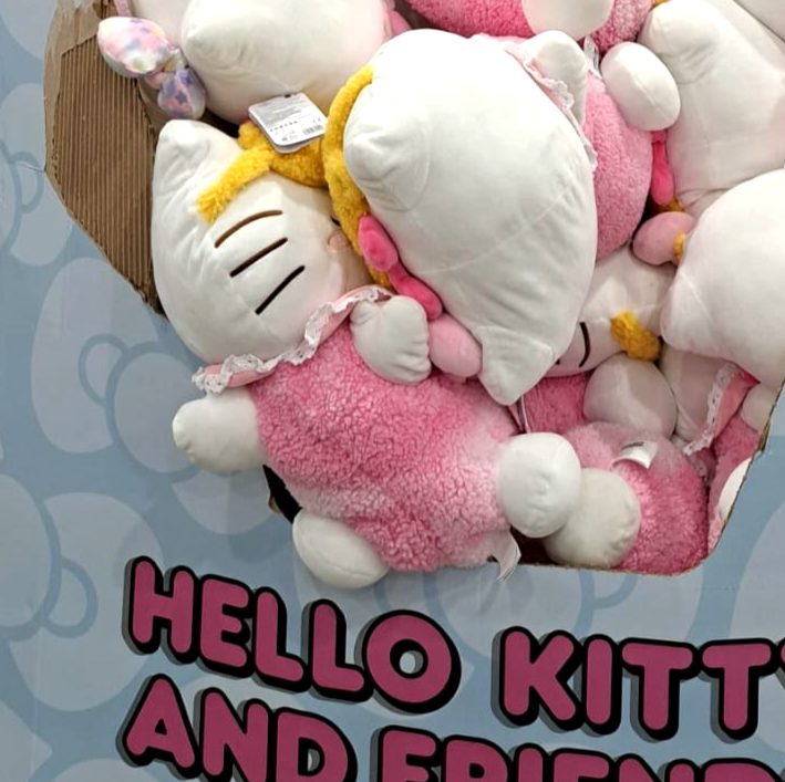 Pink and white Hello Kitty 14-inch sleeping plush toys from Costco, $19.97, ideal for kids and collectors.