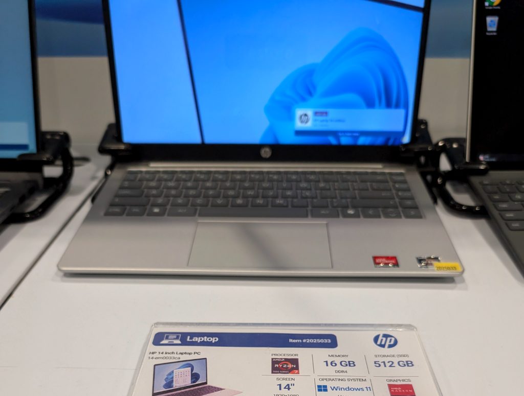 Silver HP 14-inch laptop with AMD Ryzen 7000 series, 16GB RAM, 512GB SSD, Windows 11 Home from Costco for $799.99.