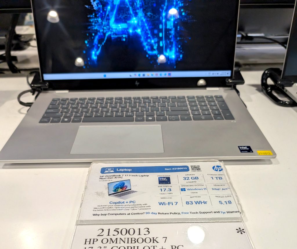 Silver HP OmniBook 7 laptop 17.3-inch display with Copilot+ PC features, available at Costco for $1549.99.