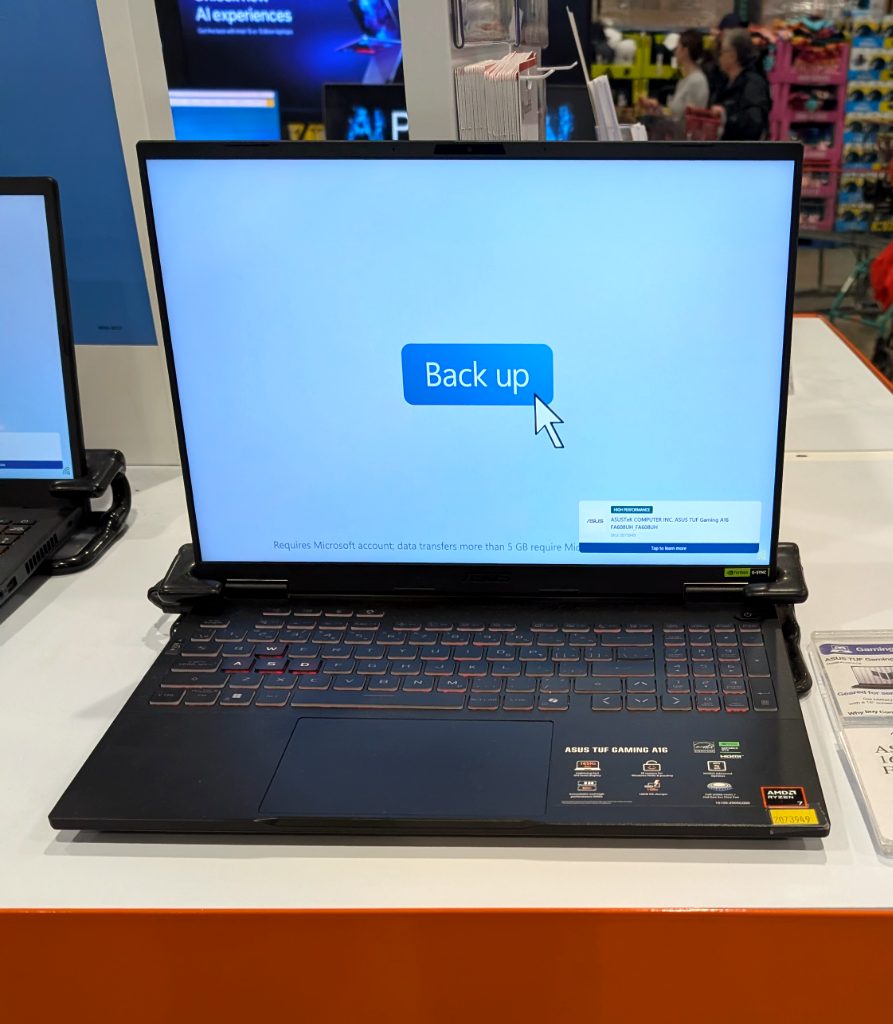 Black ASUS TUF GAMING A16 laptop from Costco, $1397.99, featuring a 16-inch screen and powerful AMD Ryzen processor.