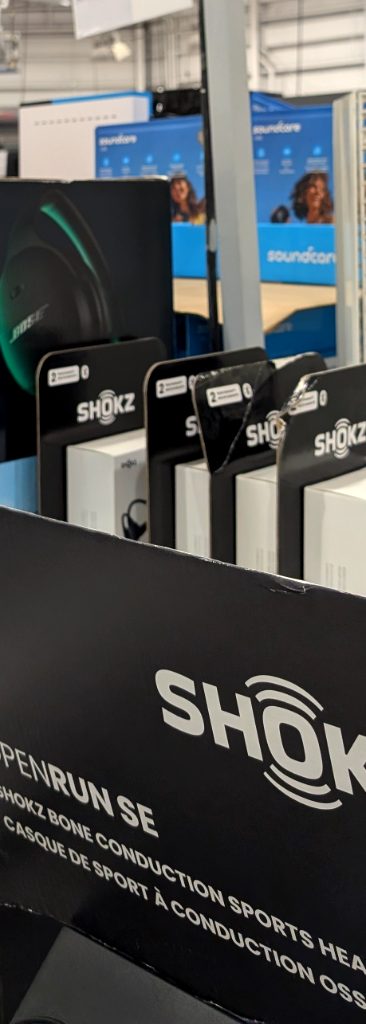 Shokz OpenRun SE bone conduction sports headphones with carry case from Costco, great for active users.