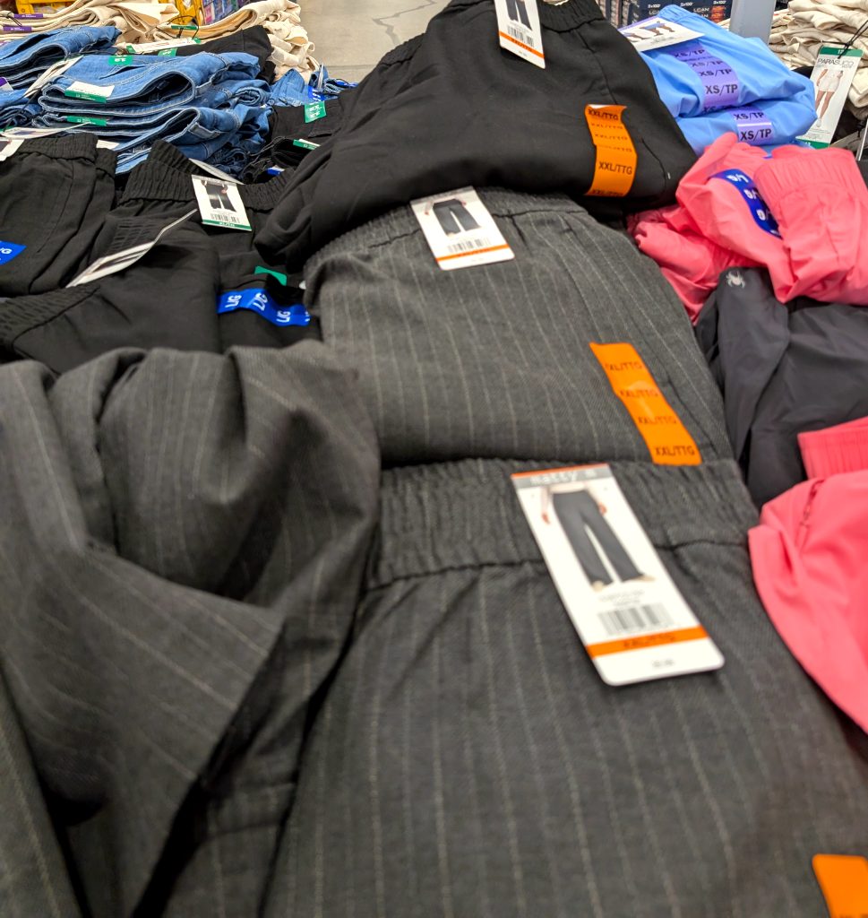 Dark grey pinstripe wide leg dress pants for women from Costco, priced at $19.99, ideal for office or smart casual wear.