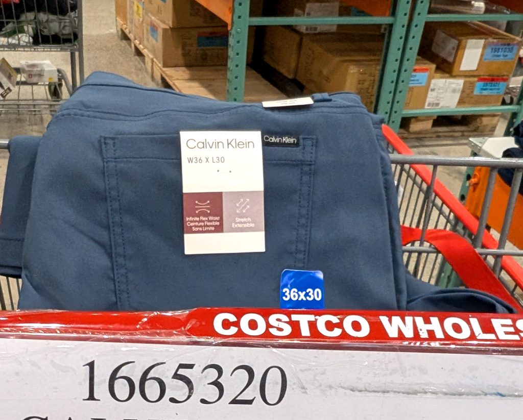 Blue Calvin Klein men's 5-pocket pants with infinite flex waist and stretch, available at Costco Wholesale.