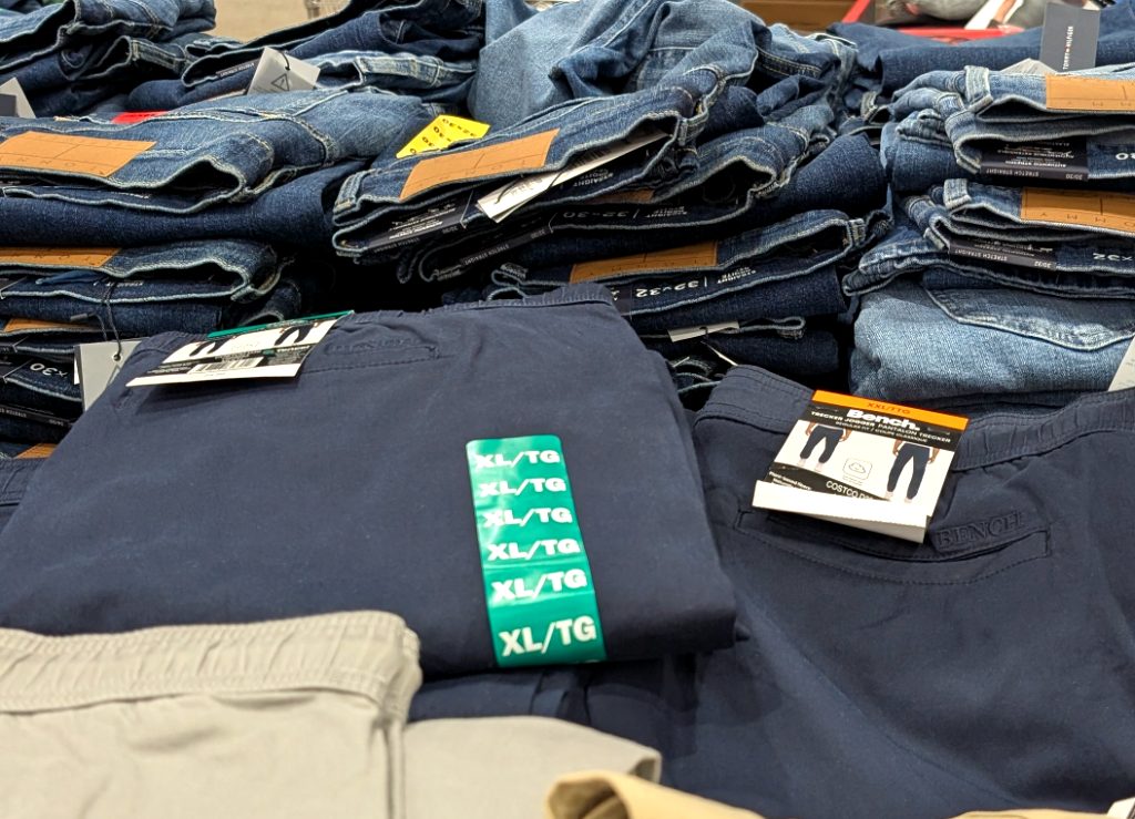 Men's navy blue Bench twill joggers, available in various sizes, on display at Costco for $19.99.