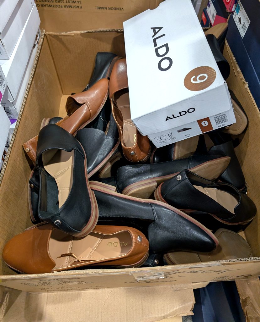 ALDO black and brown women's slip-on flats from Costco, priced at $49.99 for a fashionable and comfortable choice.