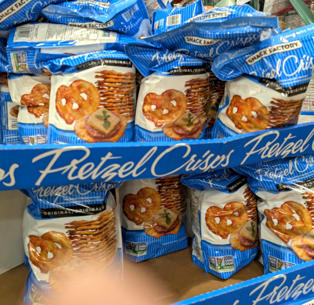 Blue and white bags of Snack Factory Pretzel Crisps Original, a savory snack, available at Costco for $5.99.