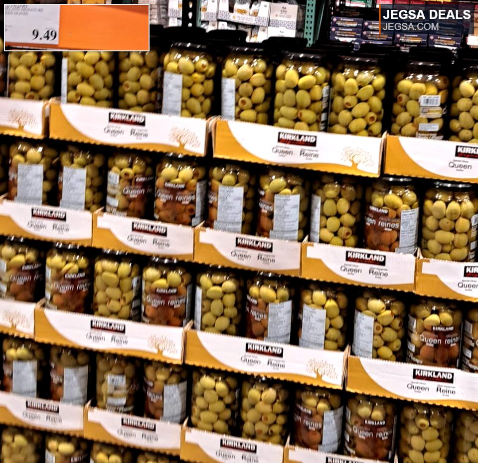 Large jars of Kirkland Signature Queen Olives from Costco, priced at $9.49, perfect for snacking or entertaining.