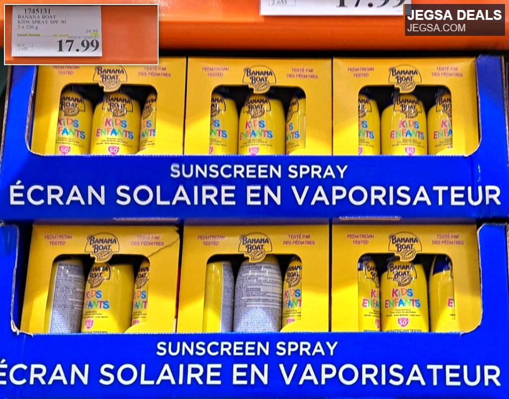 Three-pack of Banana Boat Kids Spray SPF 50 sunscreen from Costco for $17.99, featuring yellow and blue cans in a bulk display.