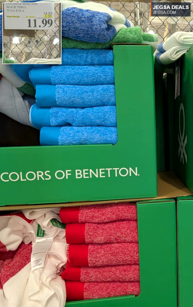 Vibrant blue, green, and red United Colors of Benetton beach towels on display at Costco for $11.99.