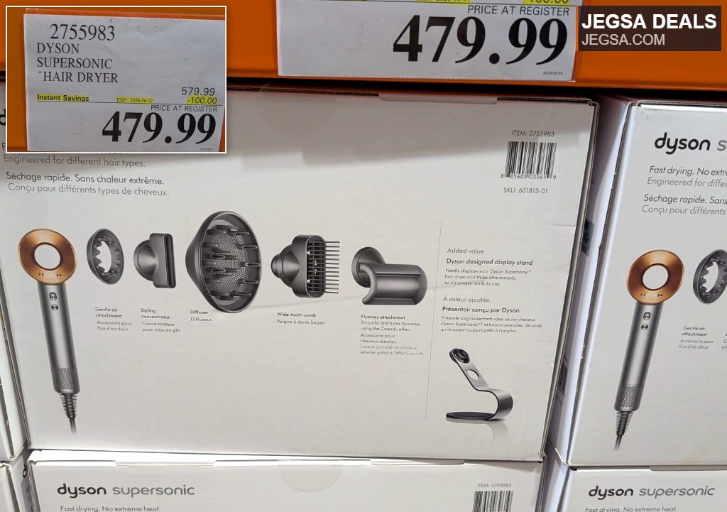 Dyson Supersonic Hair Dryer in gray and gold with multiple attachments on display at Costco for $479.99.