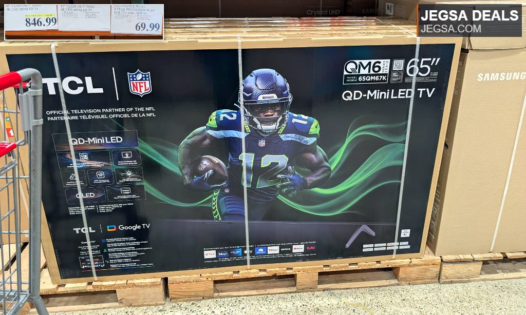 Large 65-inch TCL QD-Mini LED TV box with NFL branding and a Seattle Seahawks player, available at Costco for $846.99.