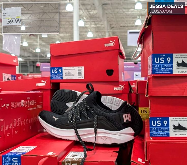 Puma black and white men's running shoes, displayed on red boxes at Costco, priced at $39.99.