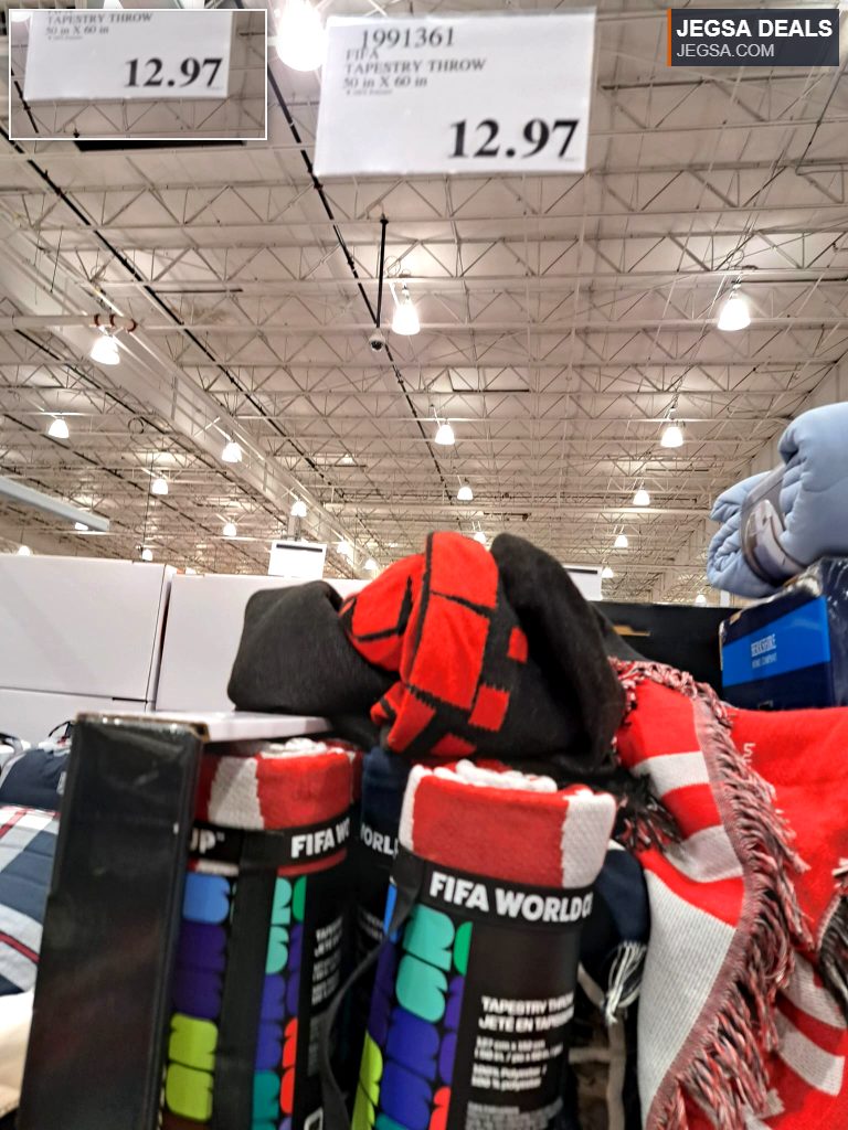 FIFA World Cup tapestry throw, a red, black, and white polyester blanket from Costco, priced at $12.97.