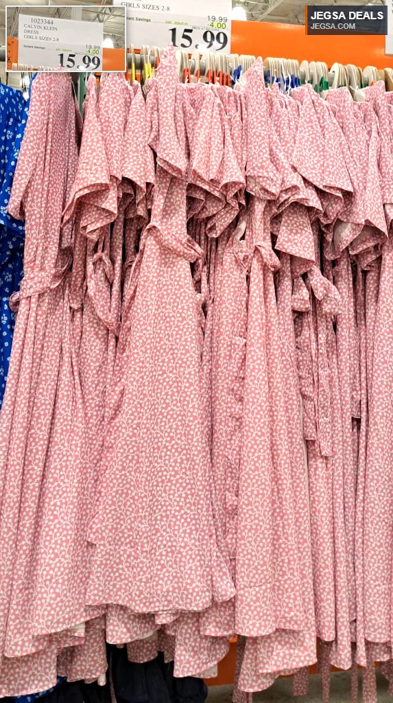 Pink and white patterned Calvin Klein girls dress from Costco, $15.99, featuring a charming floral design and ruffle details.