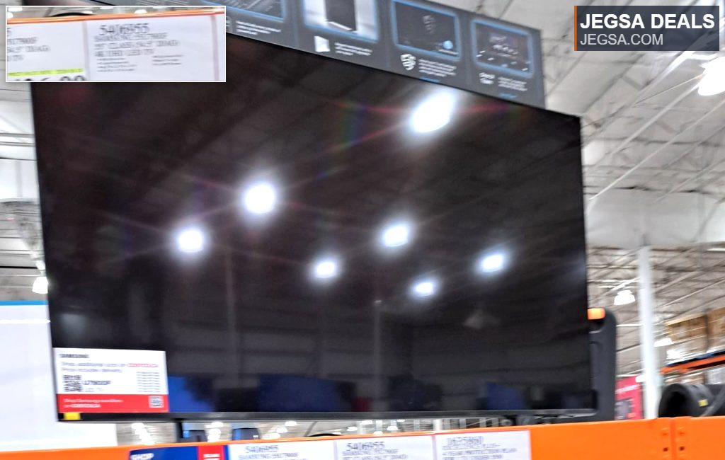 Samsung 55-inch black 4K UHD LED TV on display at Costco, priced at $426.99 for vibrant home entertainment.