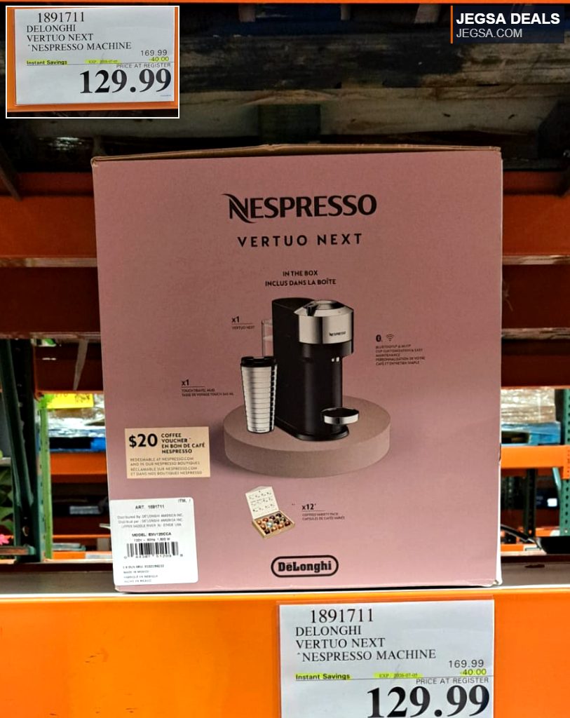 Nespresso Vertuo Next coffee machine with a travel mug, displayed in a pink box at Costco, priced at $129.99.