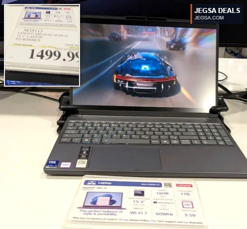 Lenovo IdeaPad Slim 13 15.3 inch dark gray laptop on display at Costco, showing a car racing game, priced at $1499.99.
