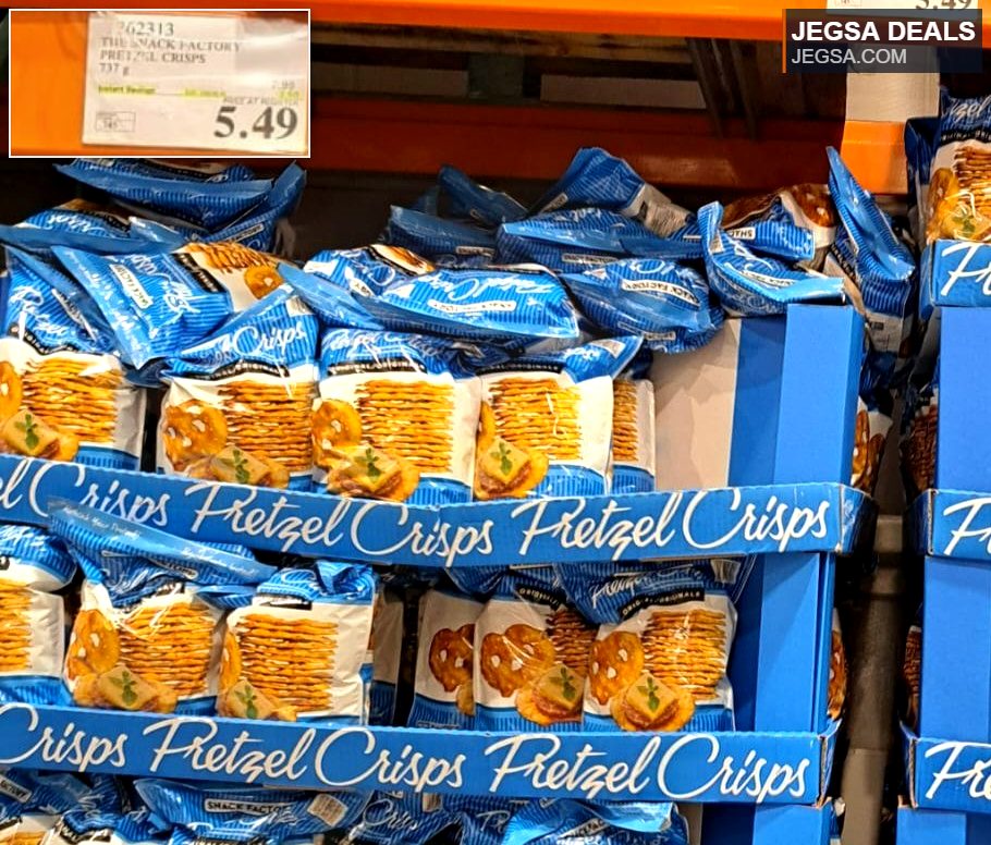 Blue bags of Snack Factory Pretzel Crisps displayed on a shelf at Costco, priced at $5.49.