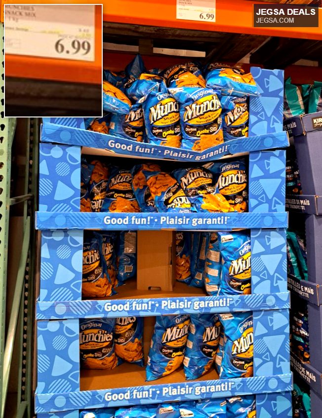 Large display box of Munchies Original Snack Mix bags, featuring popular chips like Doritos and Cheetos, available at Costco for $6.99.