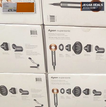 Dyson Supersonic hair dryer in silver and rose gold with multiple attachments and stand, available at Costco.