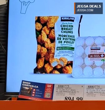 Kirkland Signature frozen chicken breast chunks in a large white bag, available at Costco.