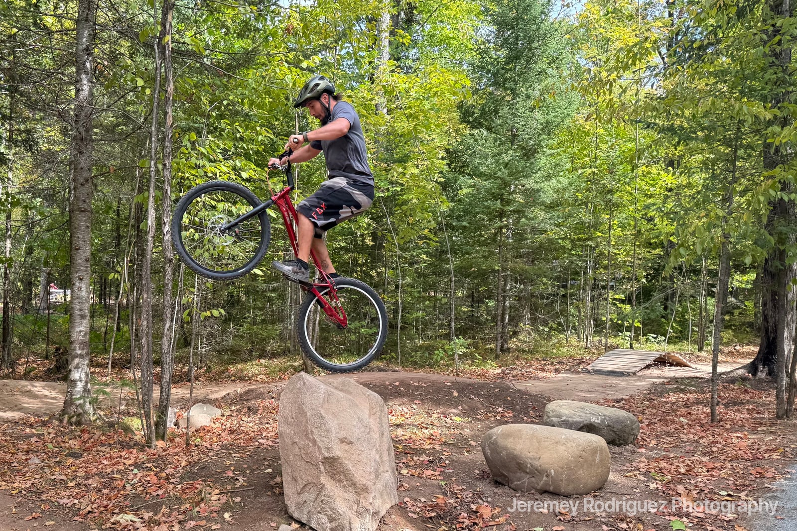 Mountain Biker Balancing on a Boulder