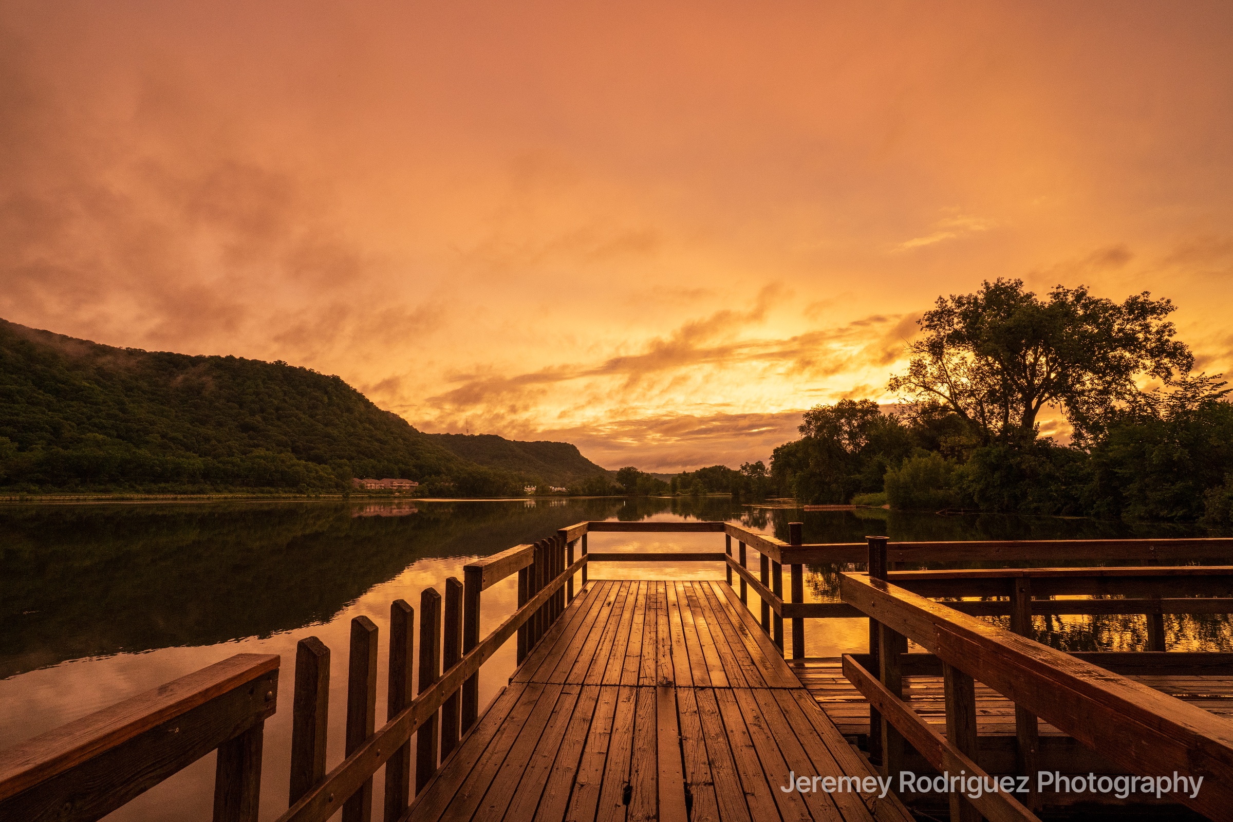 Winona Wooden Fishing Pier Under a Fiery Orange Sky in Minnesota