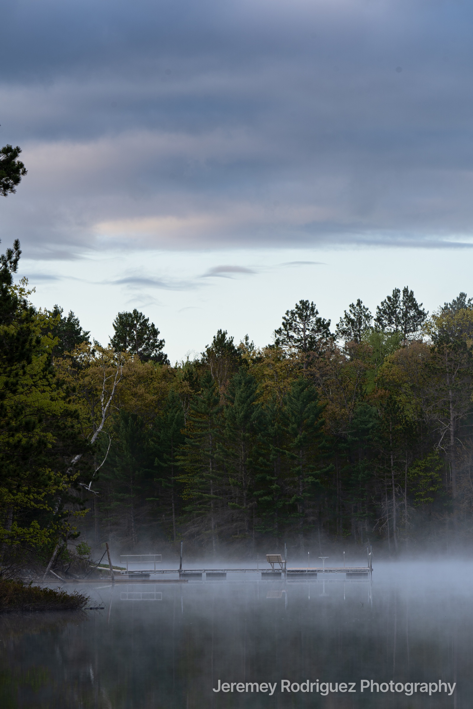 Northwoods Fog Rising Around a Quiet Lake Dock in Wisconsin